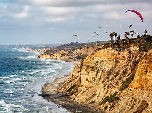 USA-California-La Jolla Paragliders soar over Blacks Beach Coastal Print